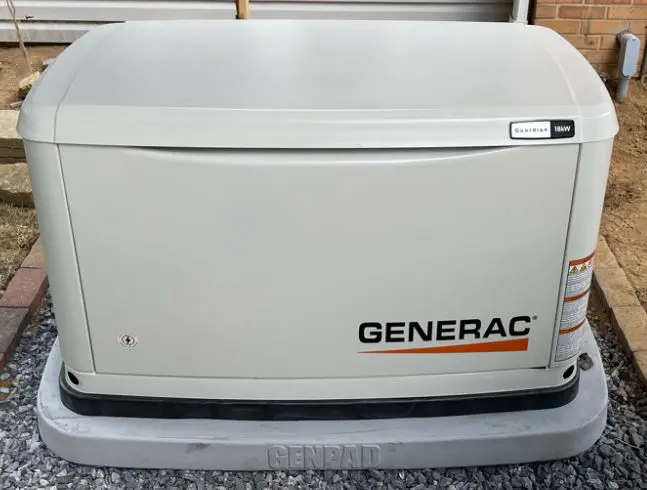 A Generac Guardian series 10 kW whole home generator installed along the side of a residential home in West Reading, PA
